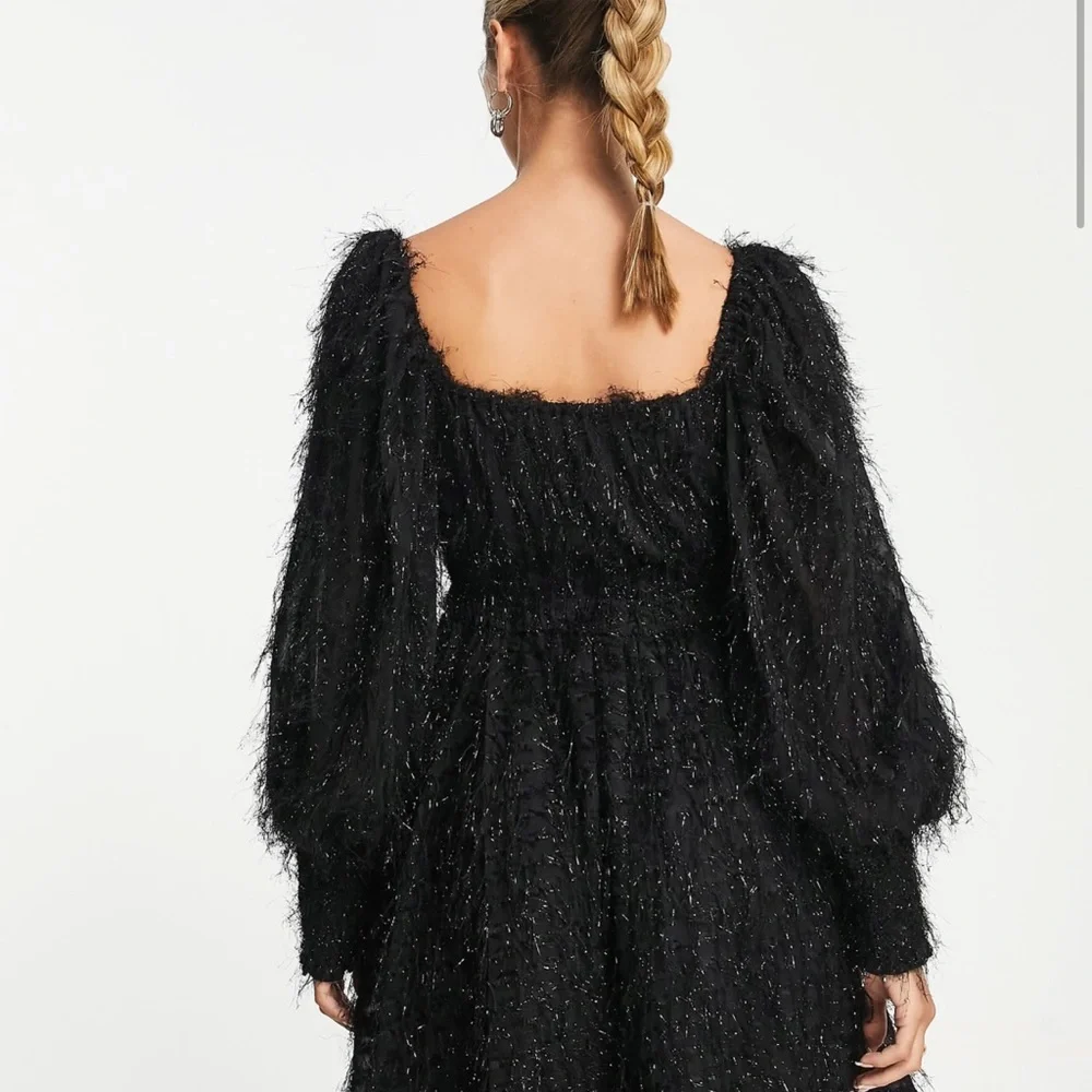 ASOS DESIGN fluffy mini dress with ruched bust and shirred cuffs in black - Picture 8 of 8